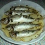 Pesce aromatizzato al limone e cotto al forno