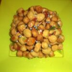 Specialità delle tavole natalizie...pallini di pasta frolla fritti e conditi con miele e confettini colorati