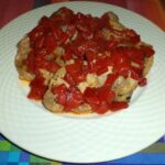 Costolette di carne di maiale con contorno di peperoni