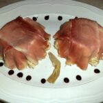 Risotto con spicchi di carciofo e dadini di speck