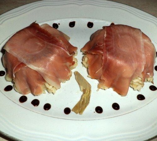 Risotto con spicchi di carciofo e dadini di speck