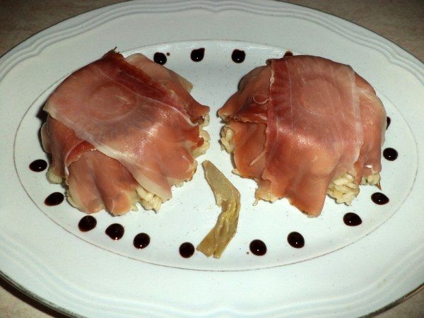 Risotto con spicchi di carciofo e dadini di speck