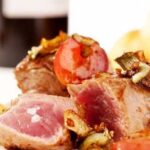 filetto di maiale con carciofi e uva